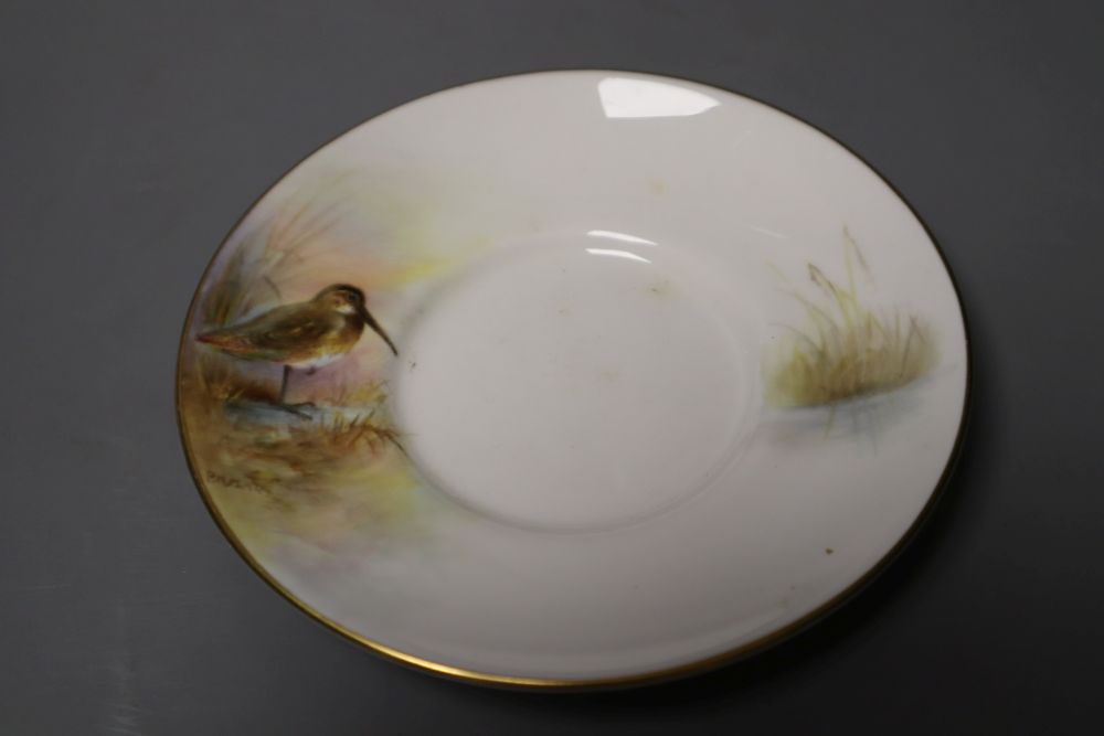 A Royal Worcester coffee can and saucer painted with game birds by P. Platts, signed, date code 1955, 12cm